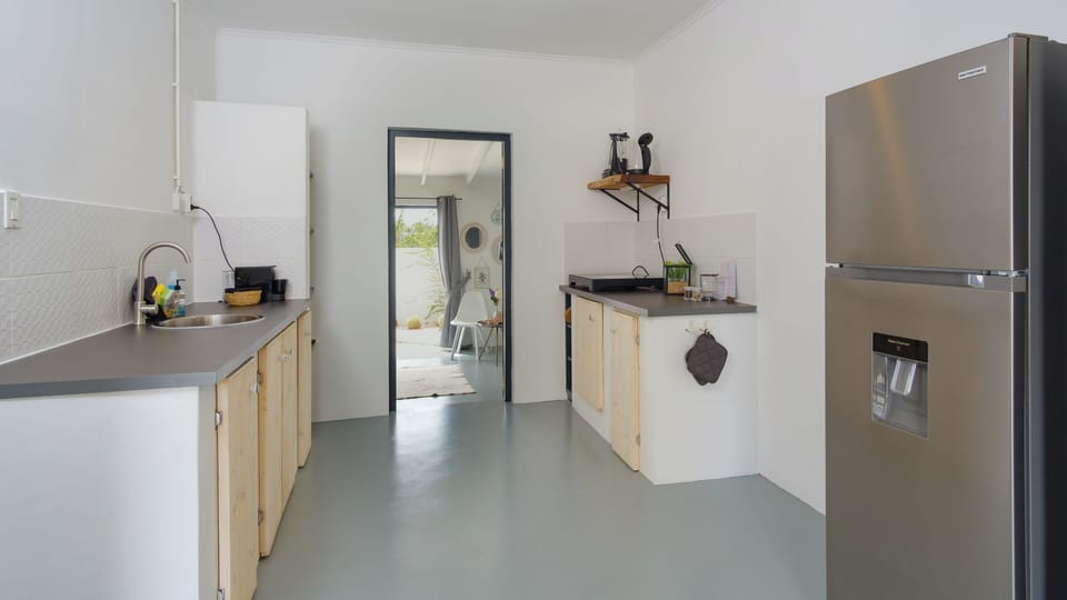 Deluxe Double Room | Private kitchen | Shared fridge, microwave, dining tables