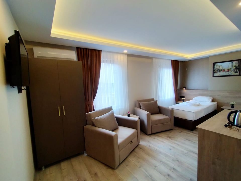 Family Room | Premium bedding, desk, laptop workspace, soundproofing