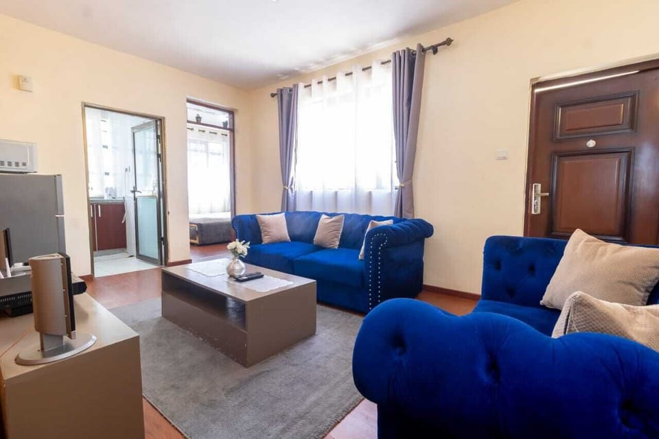 Deluxe Apartment | Living area | 24-inch Smart TV with digital channels