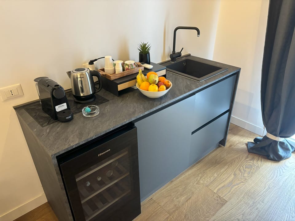 Panoramic Suite, 1 King Bed with Sofa bed, Non Smoking, City View | Private kitchen | Fridge, microwave, oven, espresso maker