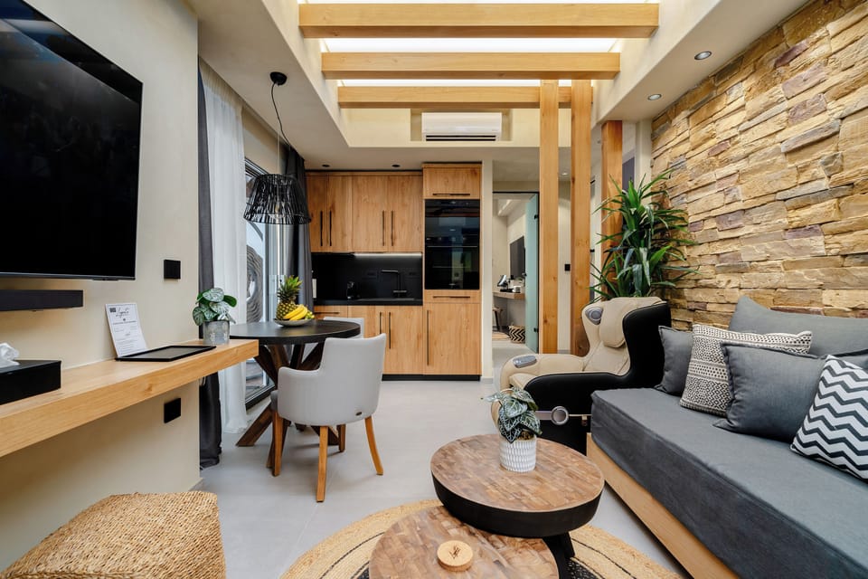 Junior Apartment, Private Pool | Living area | 55-inch Smart TV with satellite channels, computer monitors