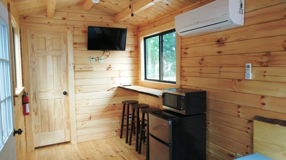 Log Cabin at Anvil Campground | Blackout drapes, iron/ironing board, free WiFi