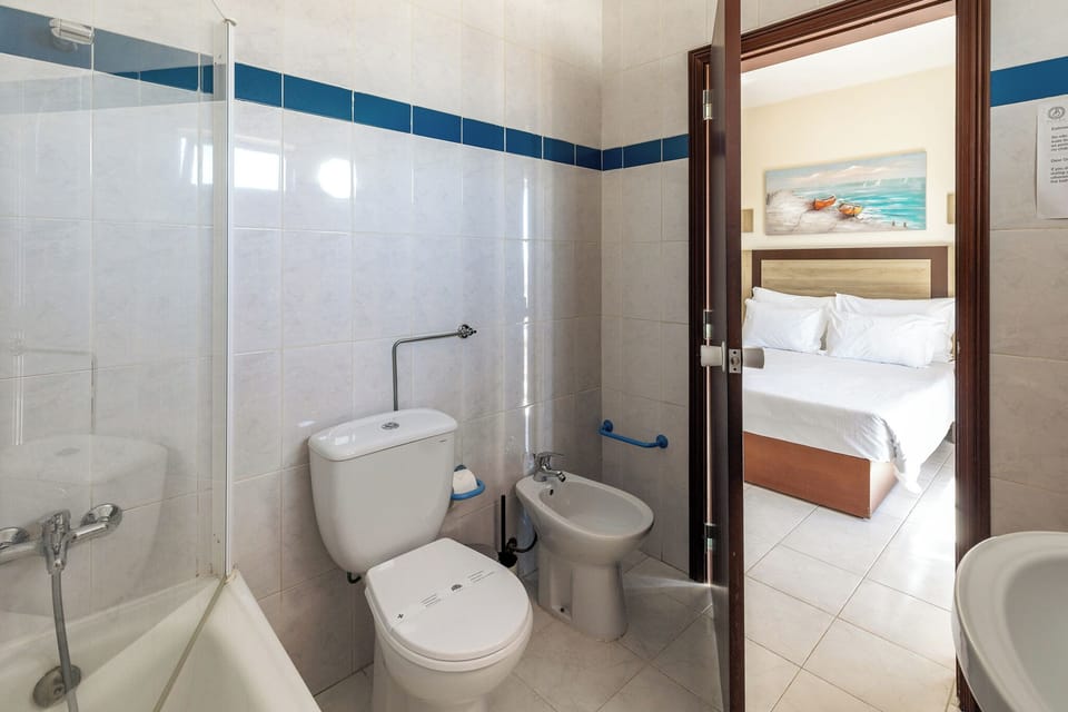 Hair dryer, bidet, towels, soap