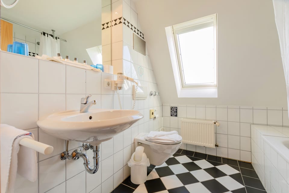 Family Suite | Bathroom | Hair dryer, towels, soap, shampoo