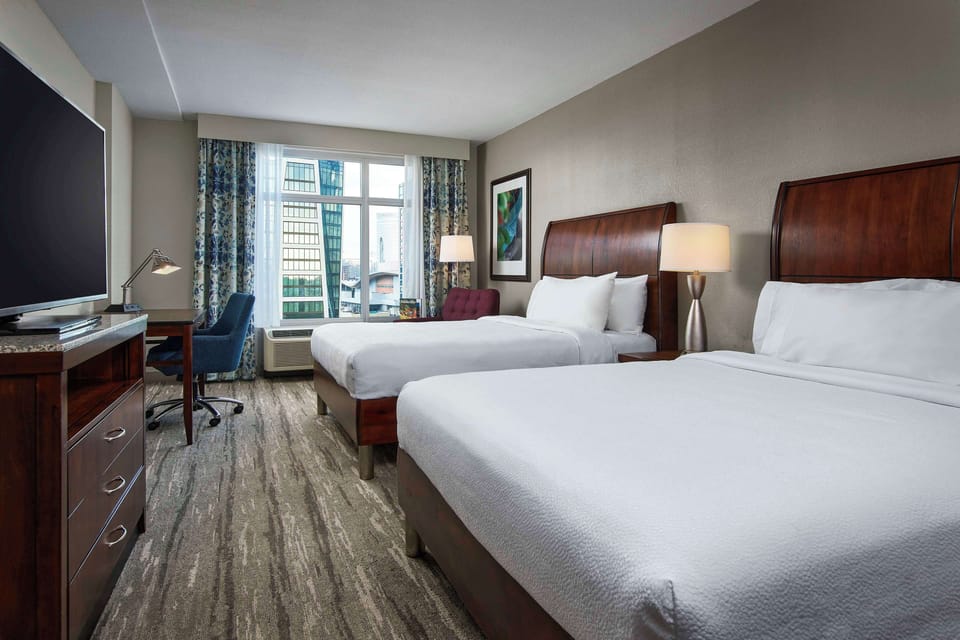 Desk, laptop workspace, blackout drapes, iron/ironing board