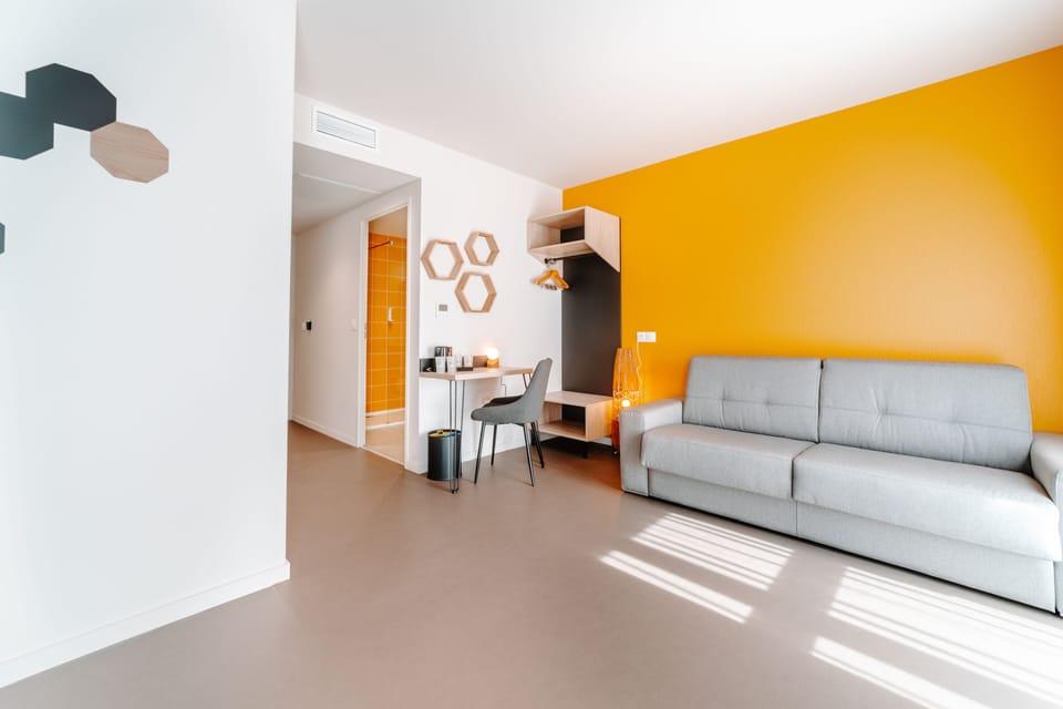 Family Room | Desk, laptop workspace, blackout drapes, iron/ironing board