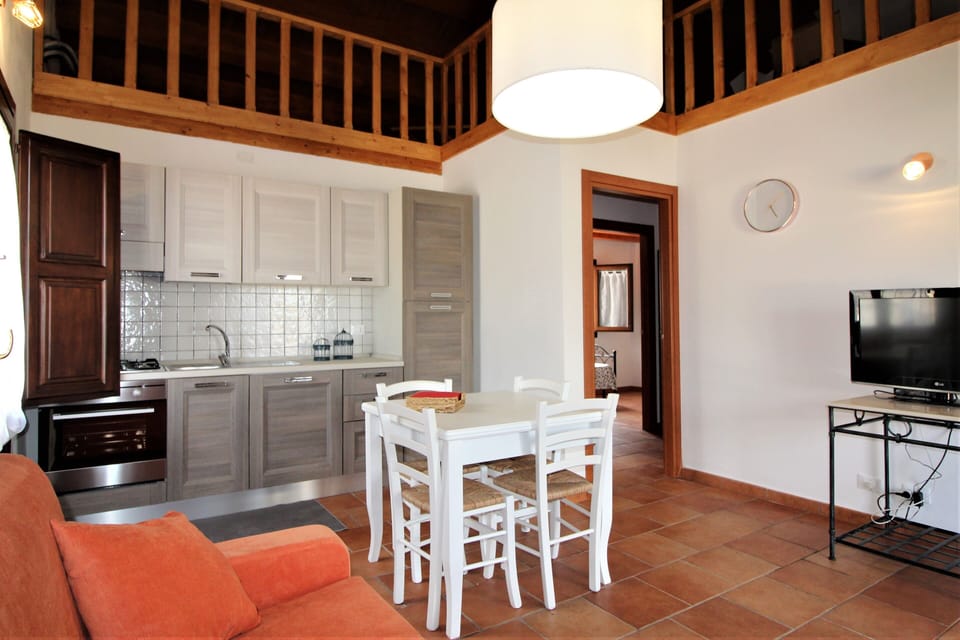 Basic Apartment, Sea View | Living area | Flat-screen TV