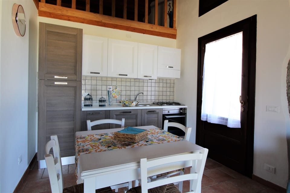 Deluxe Apartment, Sea View | Private kitchen | Oven, stovetop, highchair, cookware/dishes/utensils