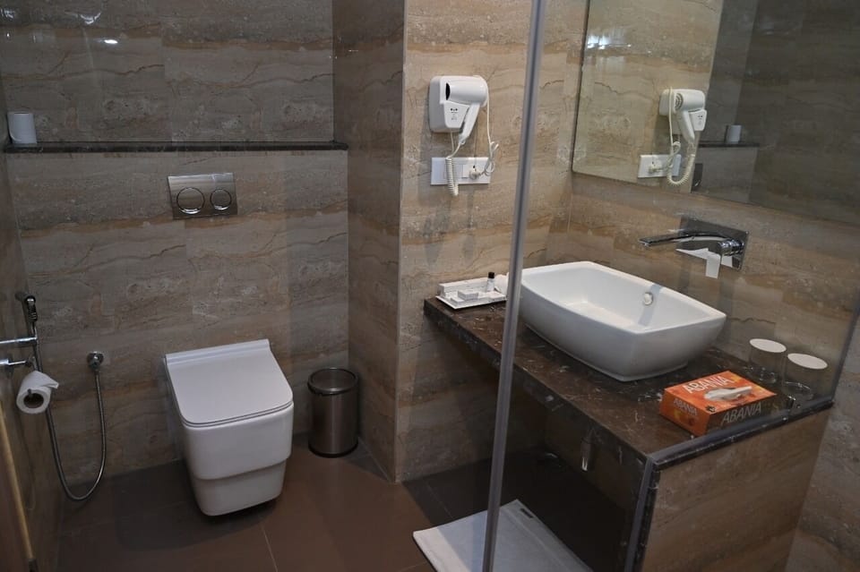 Shower, rainfall showerhead, designer toiletries, hair dryer