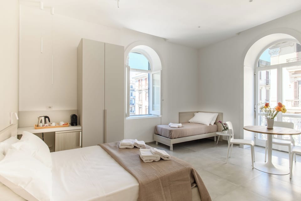 Superior Room, Balcony, Partial Sea View | In-room safe, desk, laptop workspace, blackout drapes