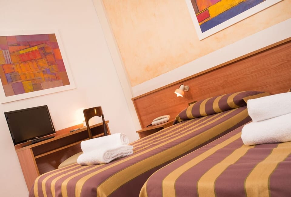 Family Triple Room | In-room safe, desk, iron/ironing board, free cribs/infant beds