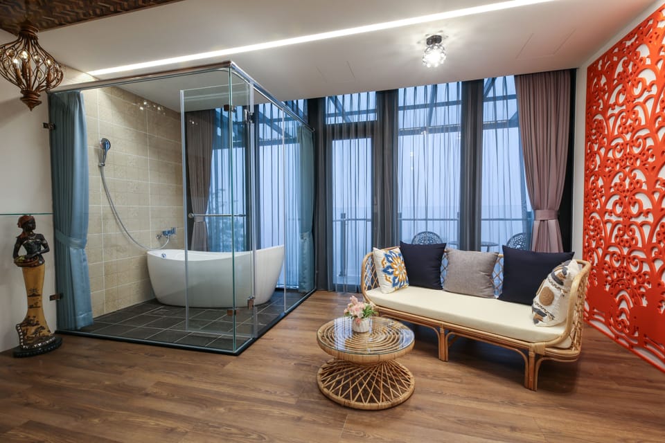 Grand Loft, 1 Queen Bed, Partial Ocean View | Bathroom | Separate tub and shower, hair dryer, slippers, towels