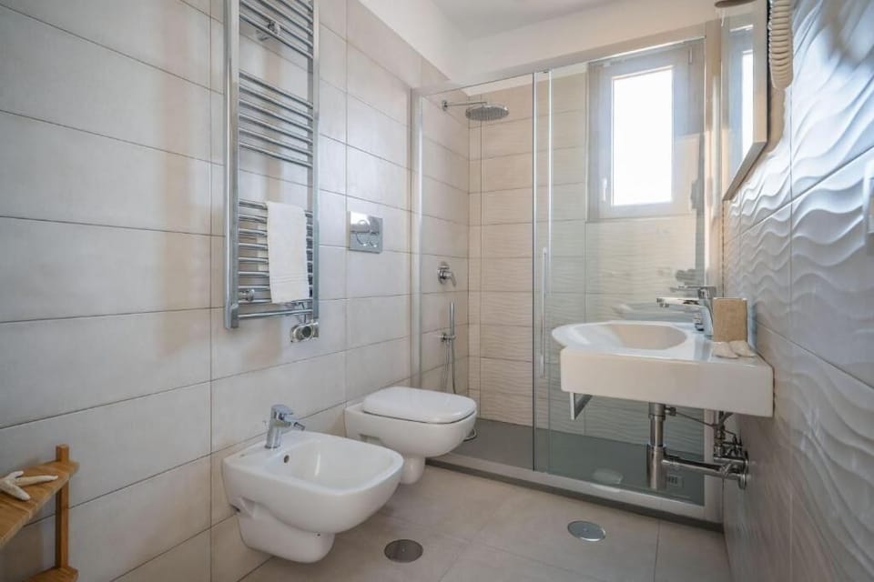 Shower, free toiletries, hair dryer, bathrobes