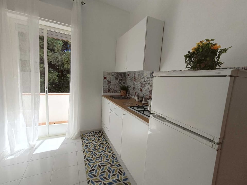 Apartment, Garden View | Private kitchen | Full-size fridge, stovetop, espresso maker, electric kettle