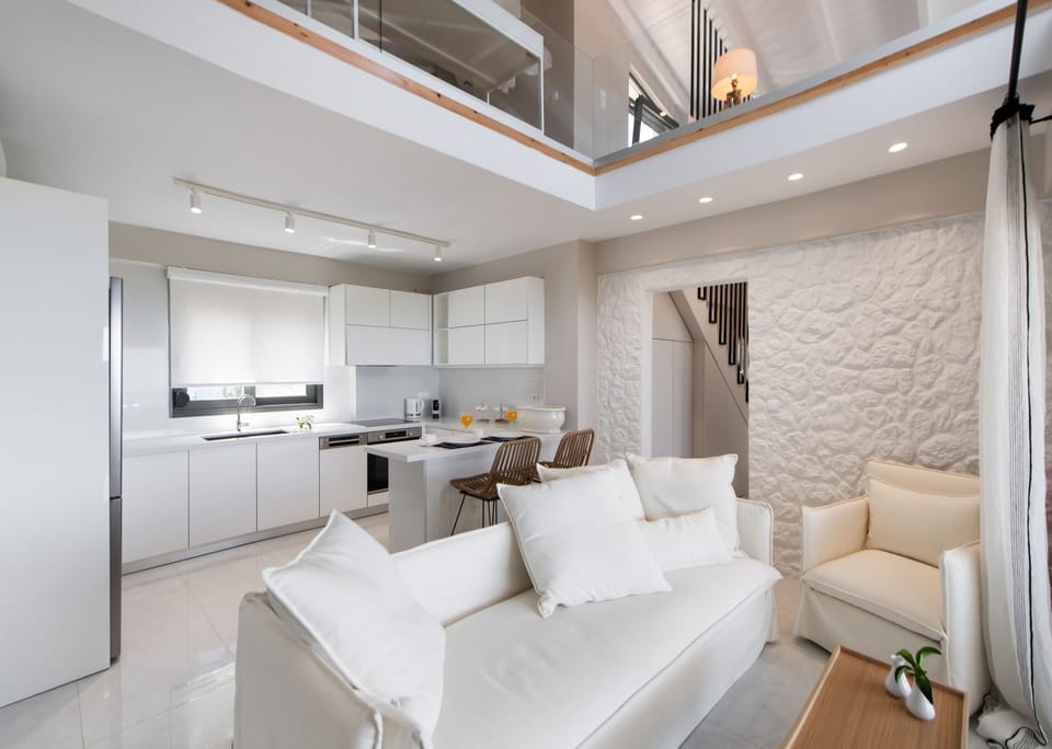 Executive Duplex | Living area | 43-inch flat-screen TV with digital channels