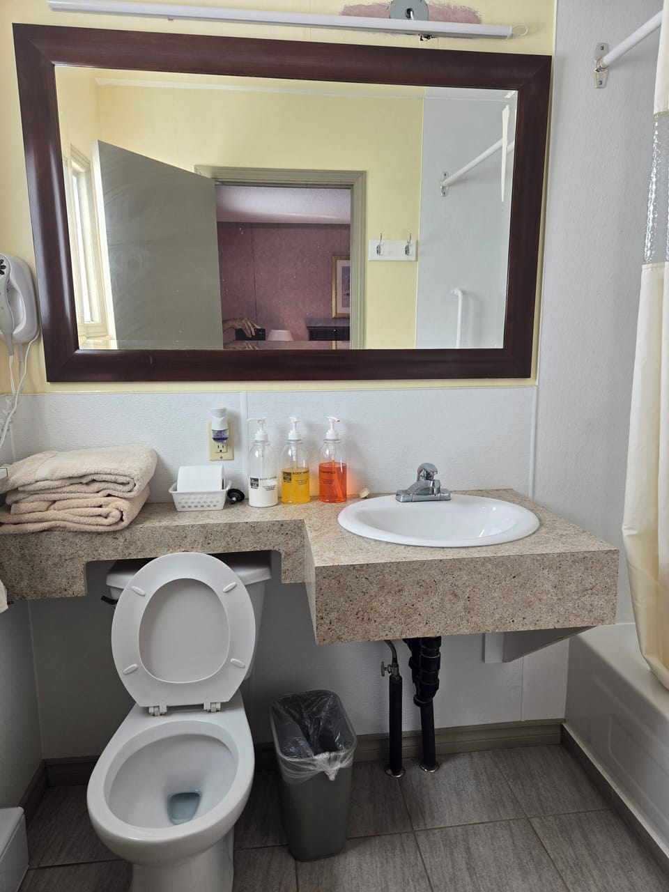 Combined shower/tub, hair dryer, towels, soap