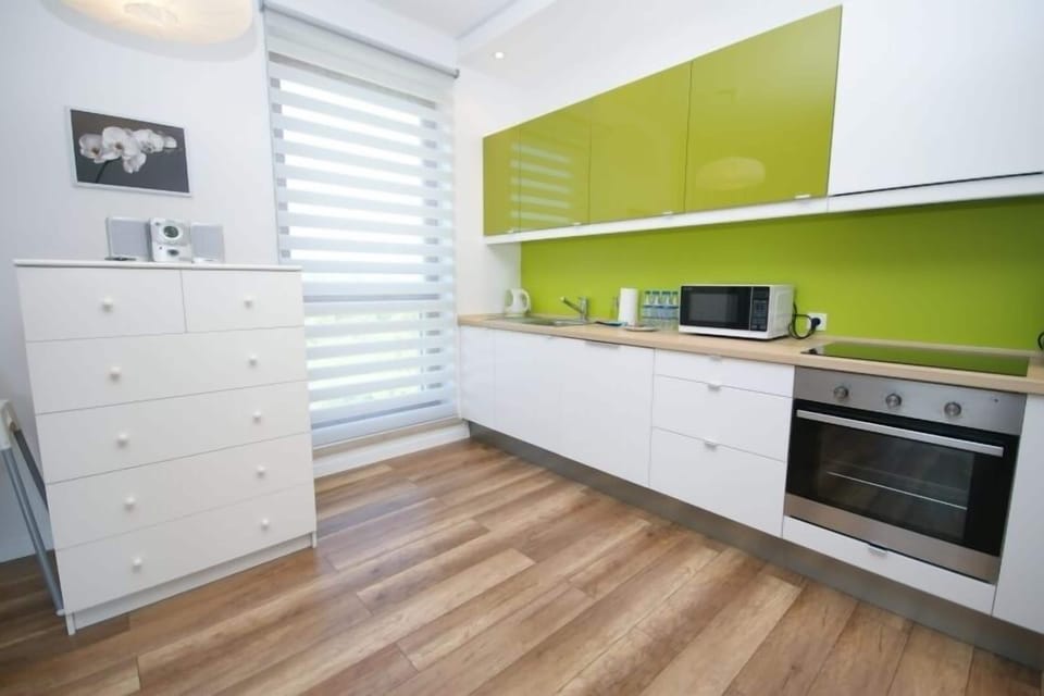 Apartment, 2 Bedrooms (Olive Suite) | Private kitchen | Coffee/tea maker, full-size fridge, stovetop, dishwasher