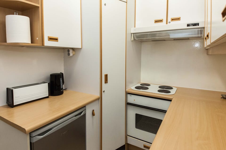 Apartment | Private kitchen | Full-size fridge, oven, toaster, cookware/dishes/utensils