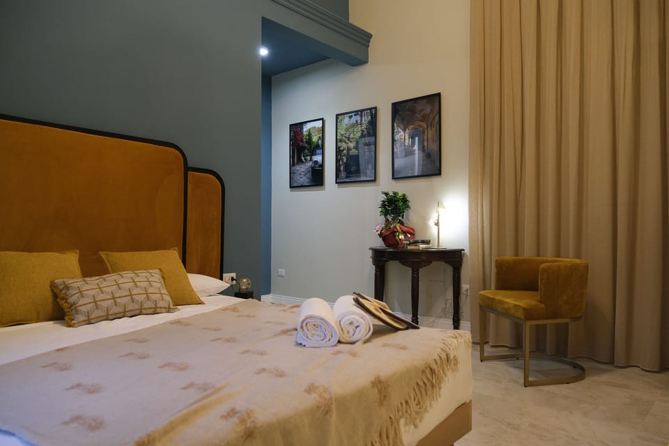 Deluxe Suite, Balcony, Garden View | Frette Italian sheets, premium bedding, down comforters, minibar