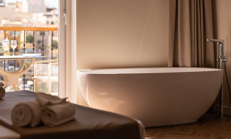 Superior Family Room, Balcony, Sea View | Deep soaking bathtub