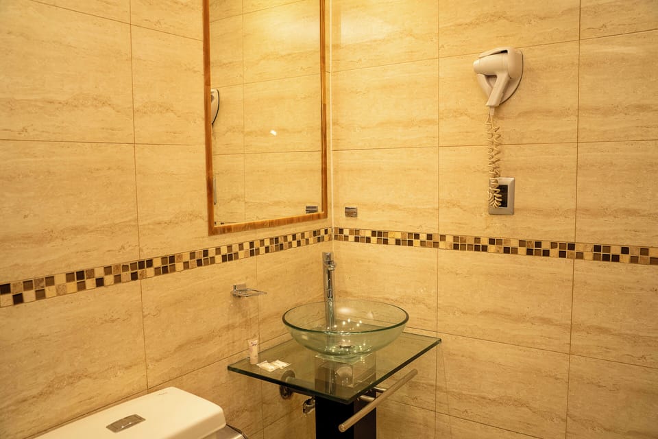 Shower, rainfall showerhead, hair dryer, towels