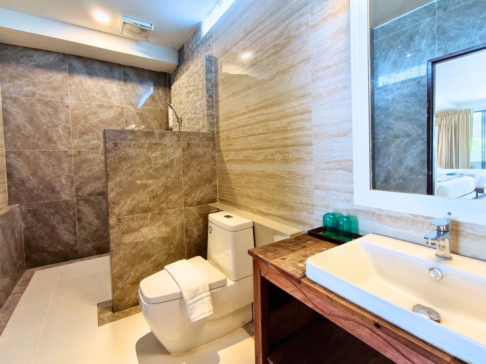Cabana Family | Bathroom | Shower, hair dryer, bathrobes, slippers