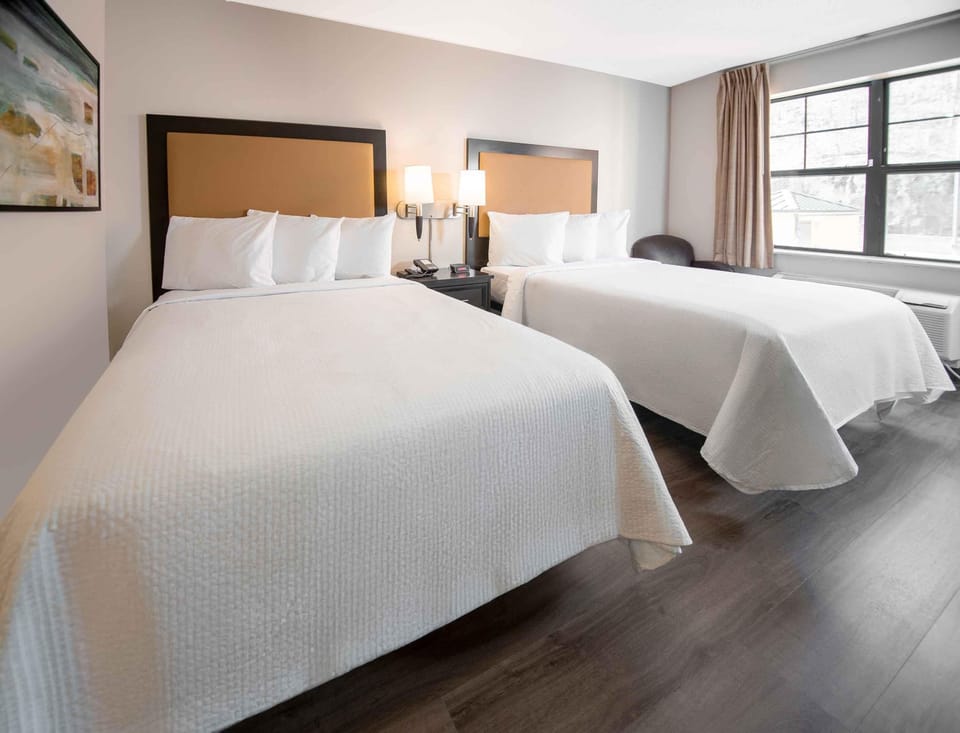 Pillowtop beds, desk, blackout drapes, iron/ironing board