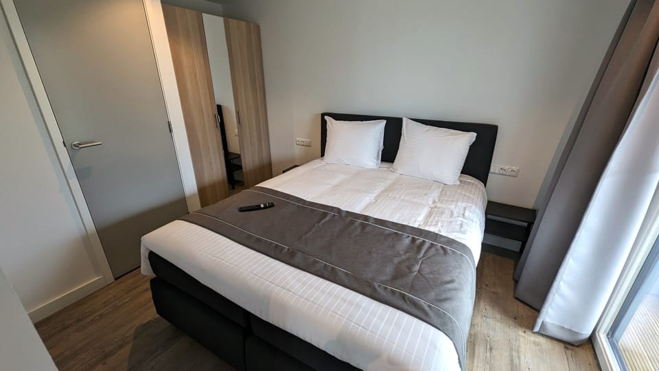 1 bedroom, premium bedding, laptop workspace, blackout drapes