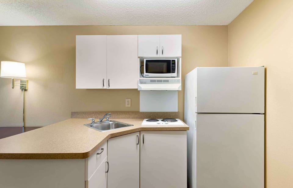 Fridge, microwave, stovetop, coffee/tea maker
