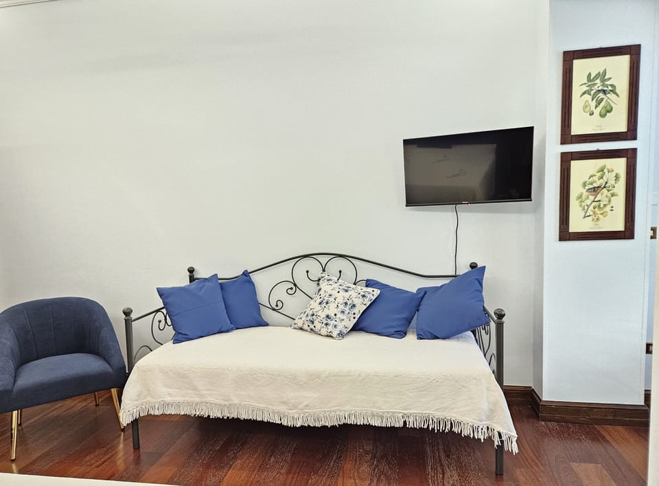 Triple Room, Garden View | Individually furnished, free WiFi