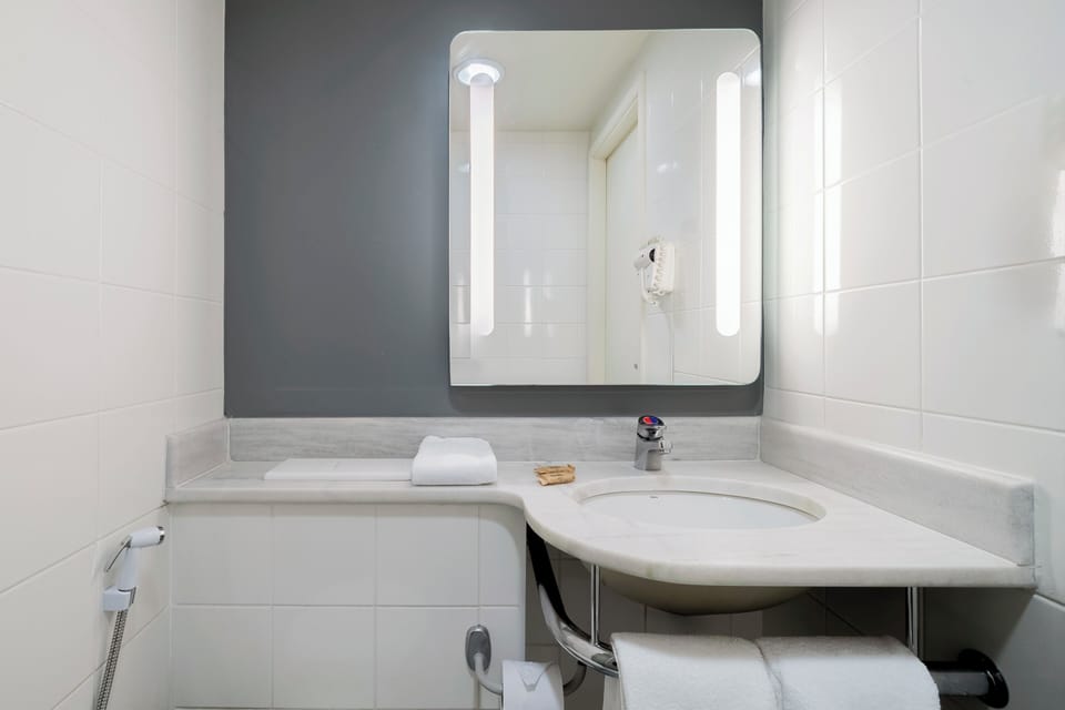Shower, eco-friendly toiletries, hair dryer, towels