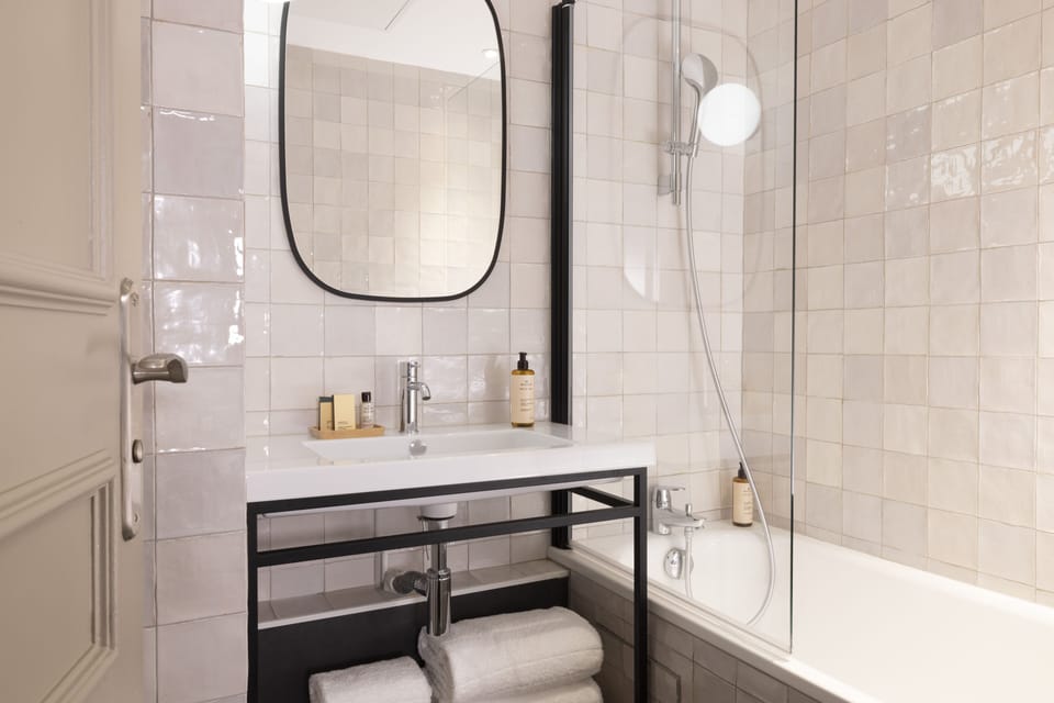 Deluxe Room | Bathroom | Designer toiletries, hair dryer, towels, soap