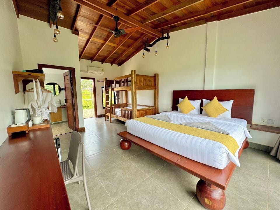 Family Room | Minibar, in-room safe, bed sheets