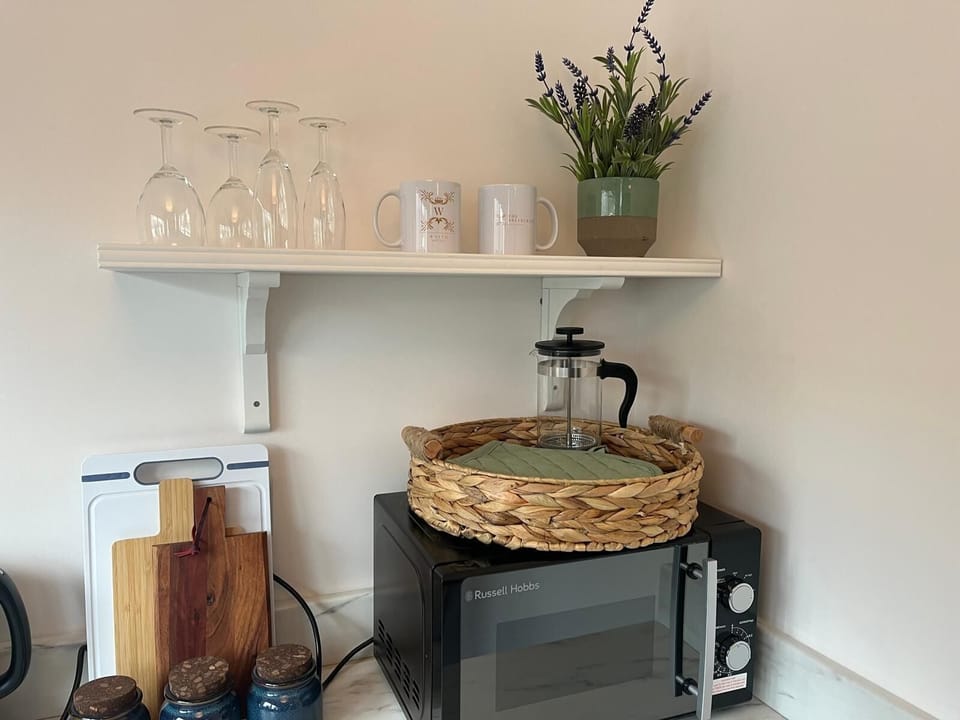 Deluxe Room | Private kitchen | Coffee/tea maker, highchair, eco-friendly cleaning products