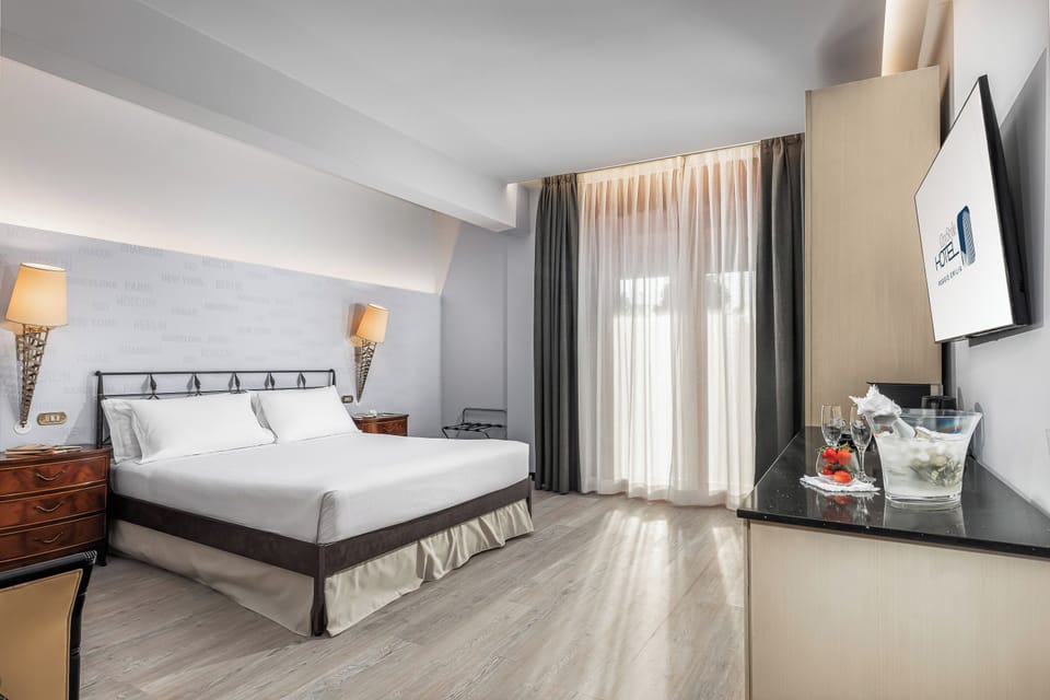 Deluxe Room, City View | Premium bedding, down comforters, memory foam beds, minibar