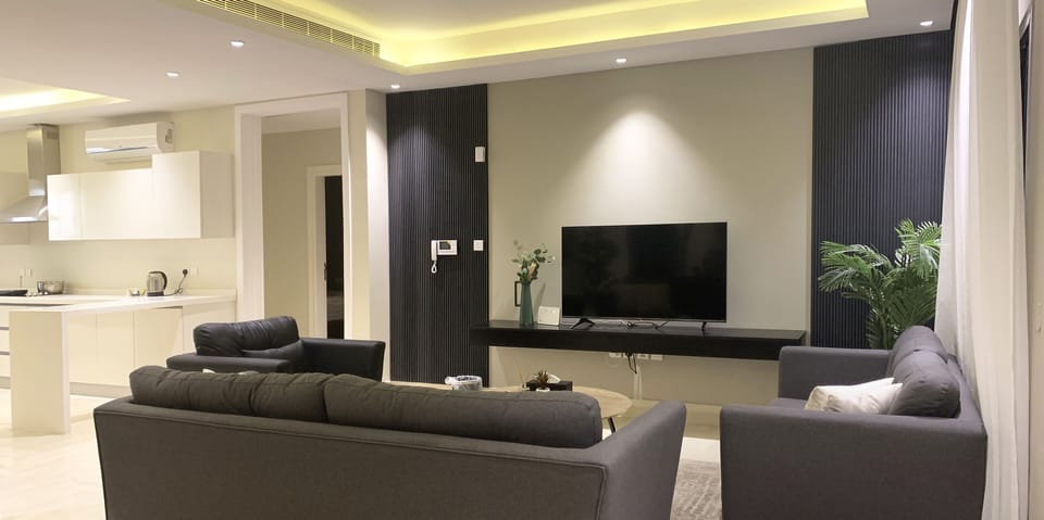 Design Apartment, 3 Bedrooms | Living area | Flat-screen TV
