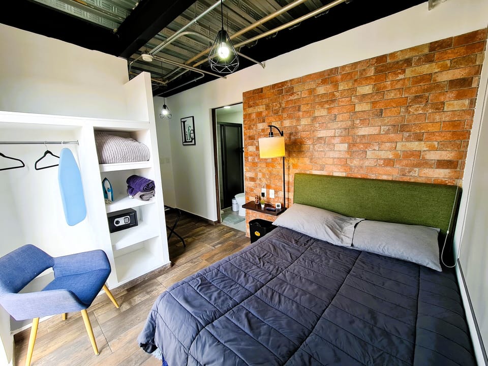 Deluxe Room, Balcony, City View | In-room safe, desk, laptop workspace, blackout drapes