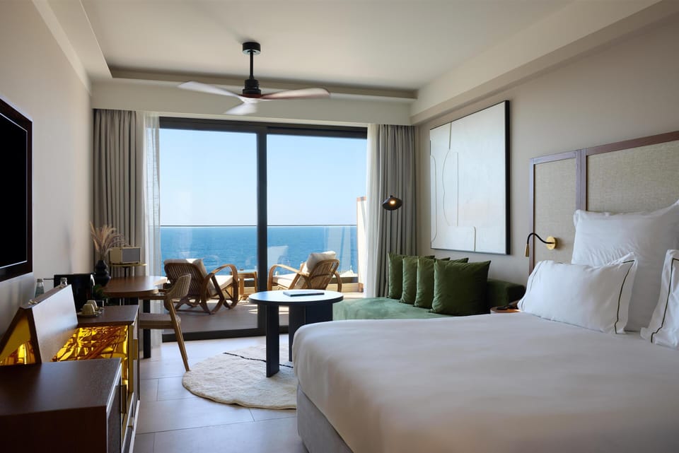 Suite, 1 King Bed, Sea View (Infinite Sea View Escape) | Living area | 50-inch Smart TV with satellite channels, TV