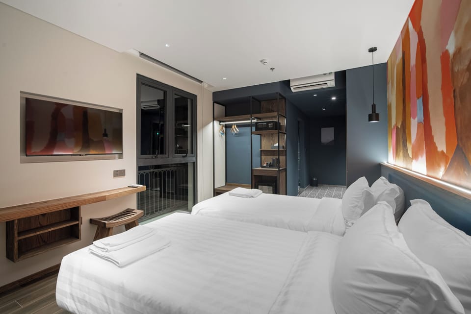 Deluxe Room, City View | Premium bedding, down comforters, memory foam beds, in-room safe