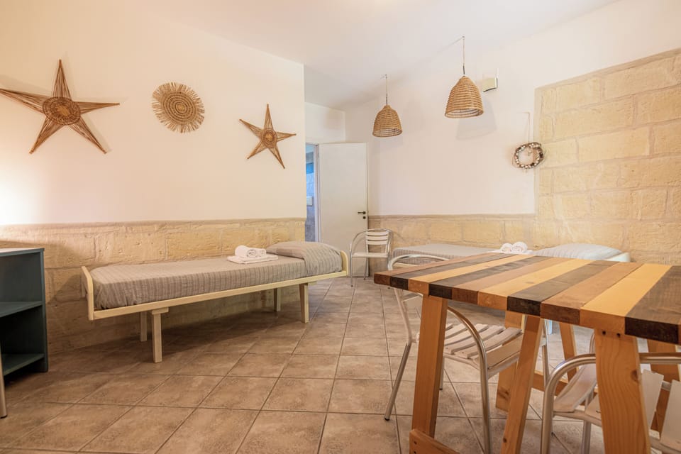 Standard Apartment | Living area | 21-inch flat-screen TV with cable channels