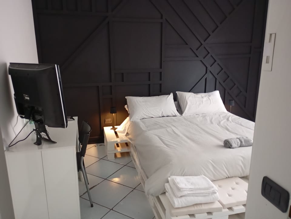 Quadruple Room, Courtyard View | Down comforters, individually decorated, individually furnished, desk