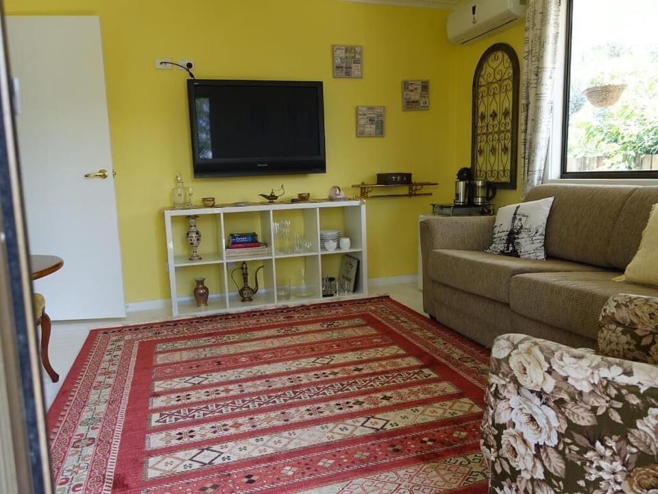Comfort Suite, Garden View | Living area | 65-inch Smart TV with digital channels