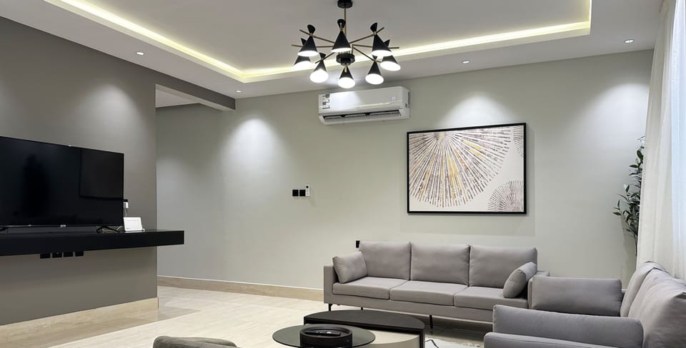 Design Apartment, 3 Bedrooms | Living area | Flat-screen TV