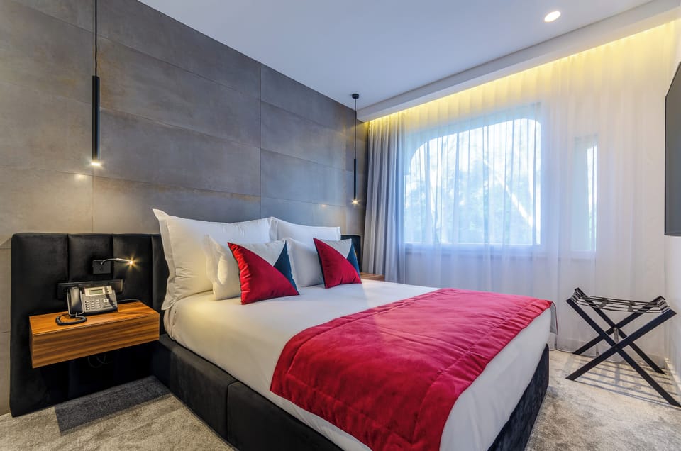 Deluxe Double Room, Pool View | Desk, soundproofing, iron/ironing board (on request), WiFi (free)