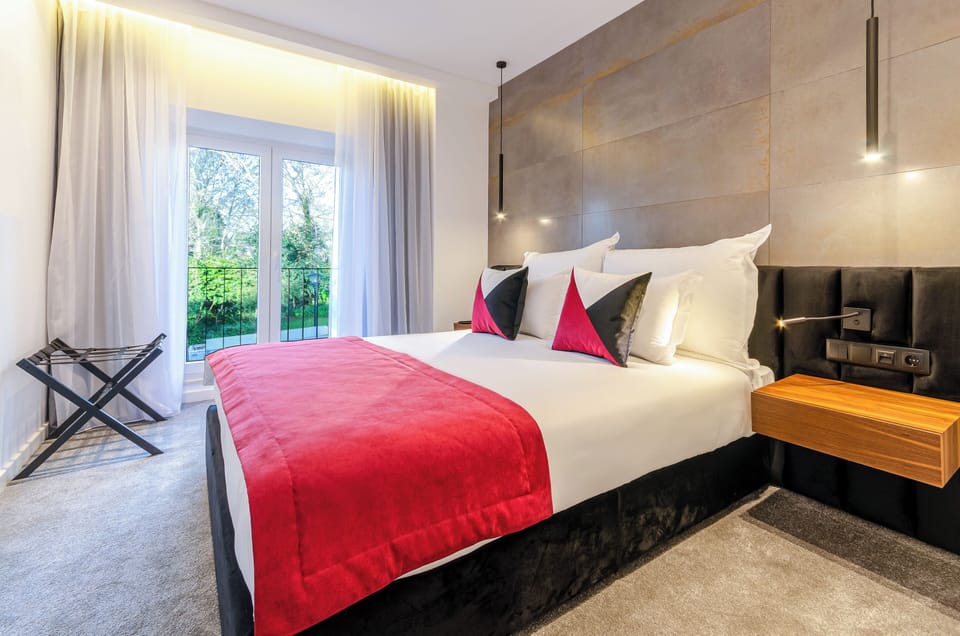 Deluxe Double Room, Pool View | Desk, soundproofing, iron/ironing board (on request), WiFi (free)