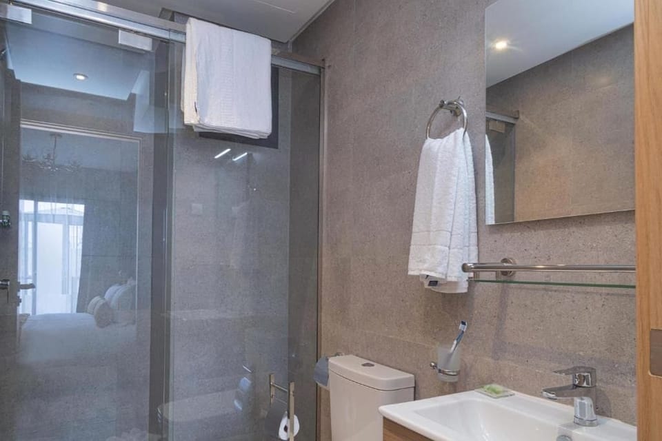 Shower, free toiletries, hair dryer, slippers