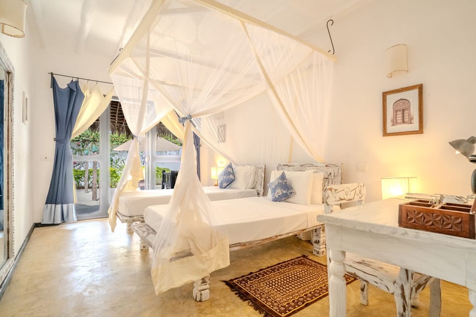 Family Suite, Garden View | Premium bedding, minibar, in-room safe, desk