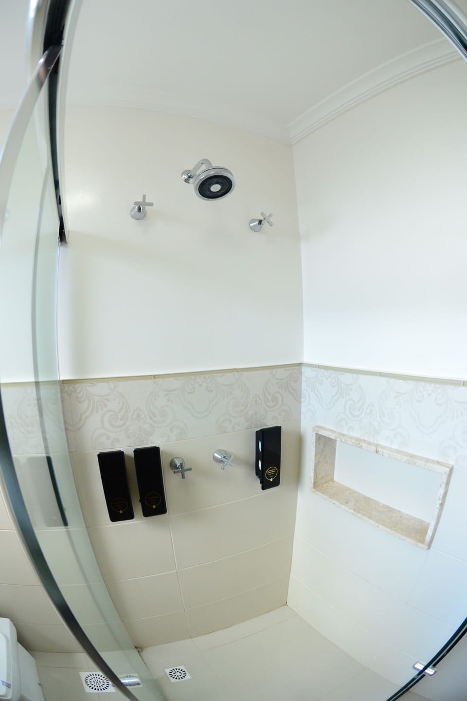 Shower, rainfall showerhead, designer toiletries, hair dryer