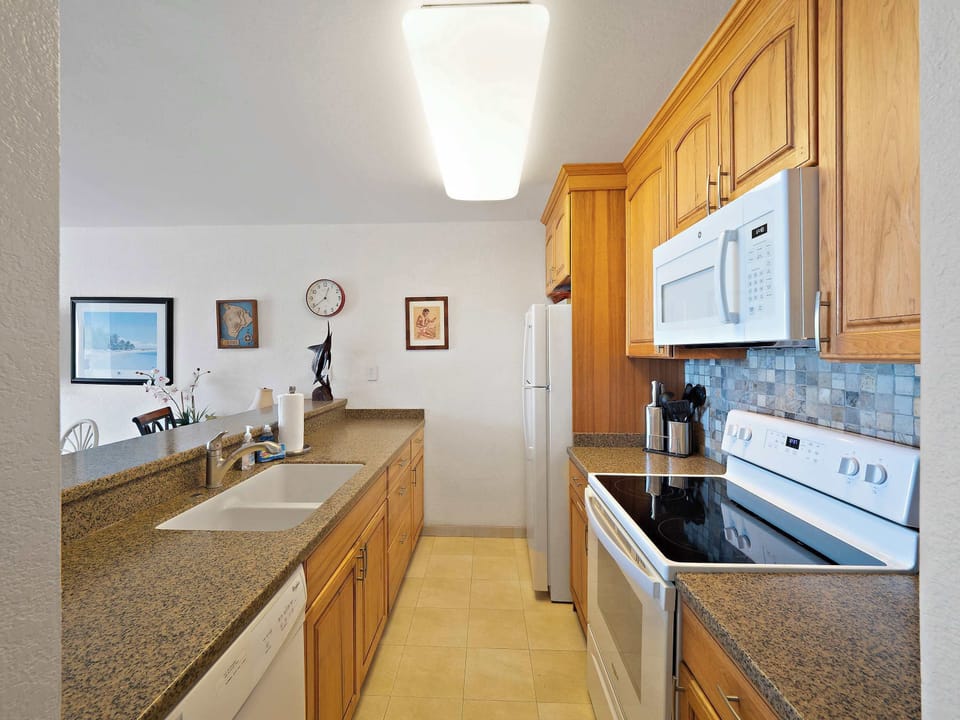 Condo, 1 King Bed with Sofa bed, Balcony, Ocean View (Kona Reef F2) | Private kitchen | Fridge, microwave, oven, stovetop