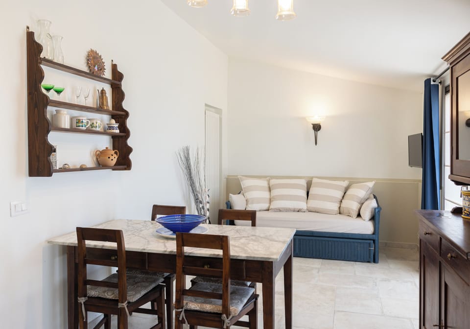 Panoramic Apartment, 1 Queen Bed with Sofa bed, Pool View | Living area | 32-inch Smart TV with cable channels